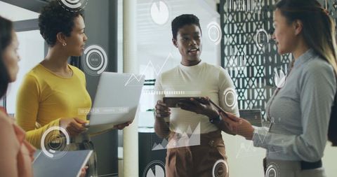 Colleagues Analyzing Data with Digital Interface in Corporate Meeting