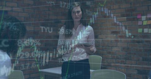 Businesswoman Presenting Financial Analytics to Team