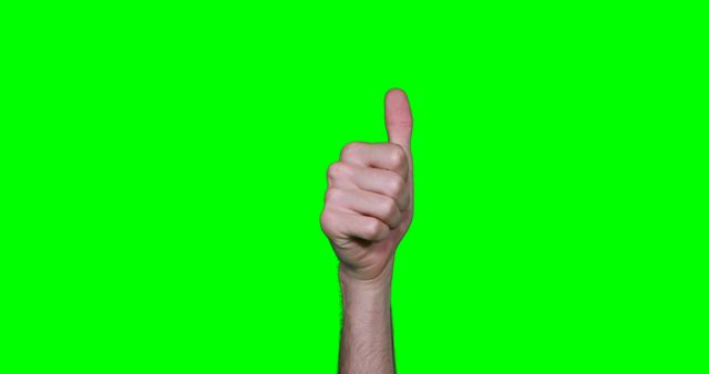 Hand showing thumbs up against green screen