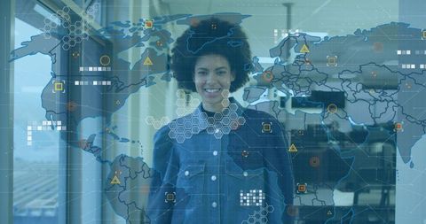 Businesswoman standing with global network overlay and hud analytics in modern office