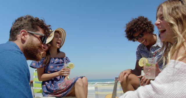 Young Friends Enjoying Beach Day, Laughing and Drinking Lemonade - Download Free Stock Images Pikwizard.com