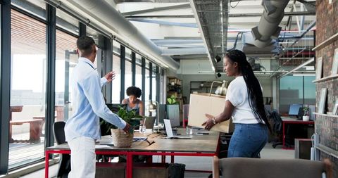Multiracial team welcoming new employee in modern office