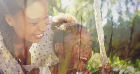 Loving Mother Pushing Daughter on Swing in Sunny Park - Download Free Stock Images Pikwizard.com