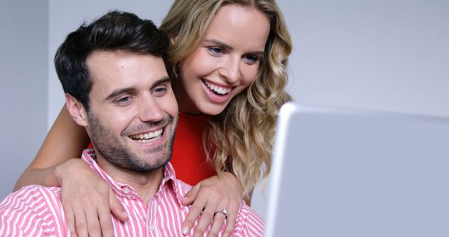 Happy Couple Excitedly Looking at Laptop Screen - Download Free Stock Images Pikwizard.com