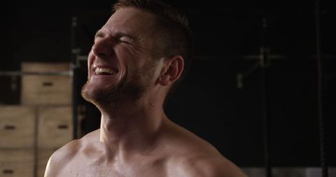 Athletic Man Smiling After Intense Gym Workout