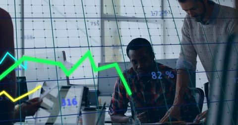 Business Analysts Examining Digital Financial Data in Modern Office Environment