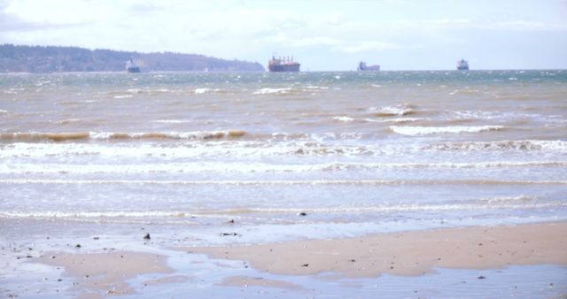 Cargo Ships on Horizon of Calm Sea and Sandy Beach - Download Free Stock Images Pikwizard.com