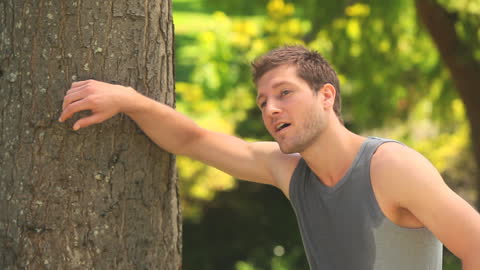 Athletic Man Resting After Jogging in Nature