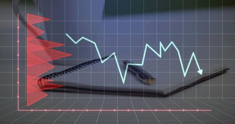Holographic financial dashboard overlay on notebook with pen, grid analytics visualization