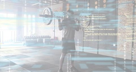 Male athlete lifting barbell in industrial gym with digital fitness data overlay