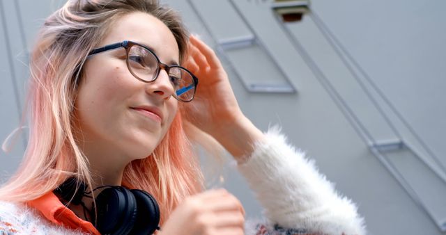 Relaxed woman with pink hair smiling in glasses - Download Free Stock Images Pikwizard.com