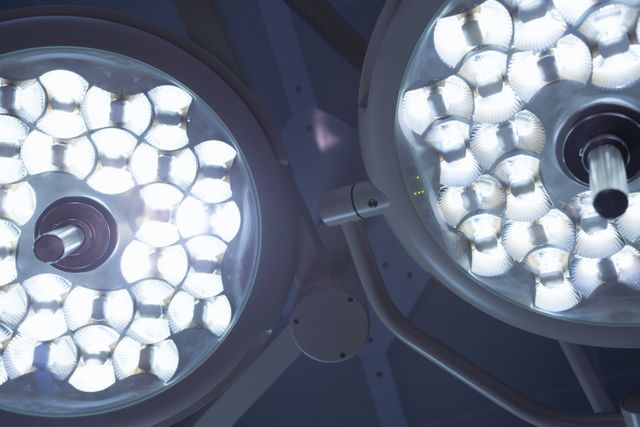 Low angle view of surgical lights in operation room at hospital