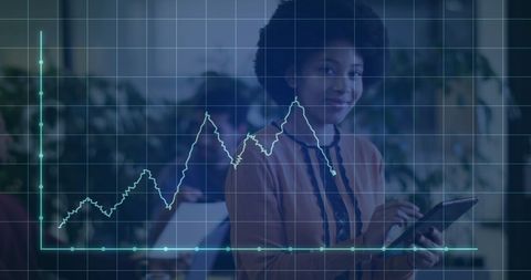 An african american businesswoman analyzing data in modern office