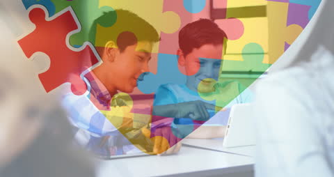 Children Using Tablets with Overlay of Autism Awareness Graphics