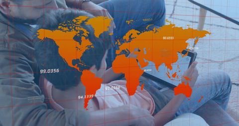Father and Son Sharing Tablet on Couch with World Map Overlay, Family Digital Bonding