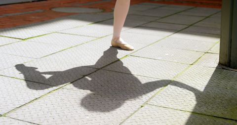 Dynamic Movement Shadow on Sunny Pavement with Copy Space
