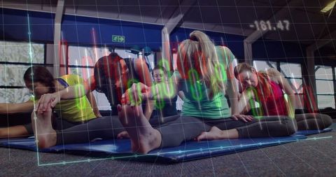 Group Fitness: Women Practicing Yoga in Studio with Data Overlay