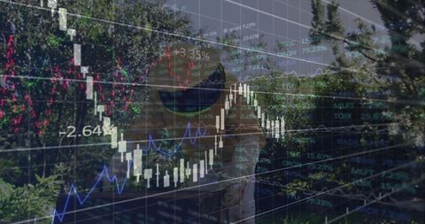 Senior Professional Overseeing Financial Charts with Outdoor Setting