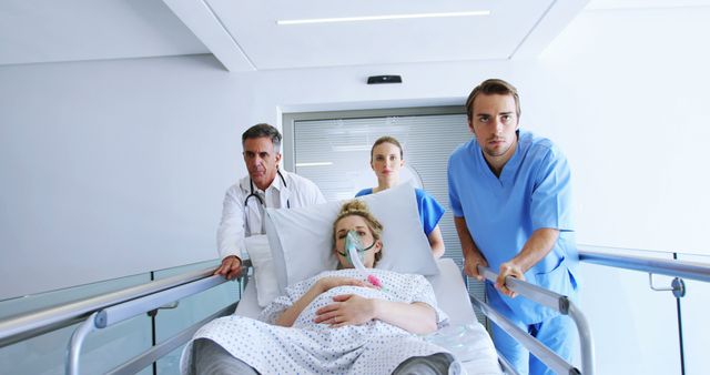 Medical Team Pushing Patient on Hospital Gurney - Download Free Stock Images Pikwizard.com