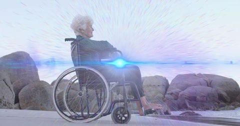Senior Woman in Wheelchair Enjoying Serene Beach Moment
