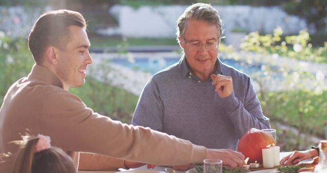 Family Enjoying Outdoor Meal with Autumn Decorations - Download Free Stock Images Pikwizard.com