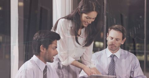 Diverse Team Collaborating on Business Analytics at Office