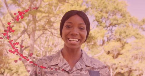 Joyful African American Female Soldier with Heart Overlay