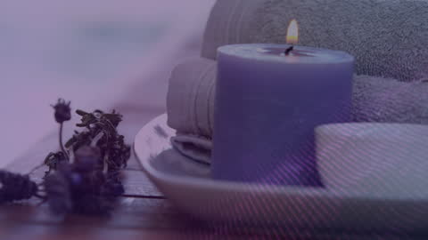 Serene Spa Setting with Candle and Towels for Relaxation