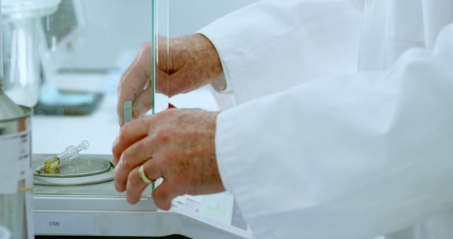 Scientist in laboratory conducting precise measurements with lab equipment - Download Free Stock Images Pikwizard.com