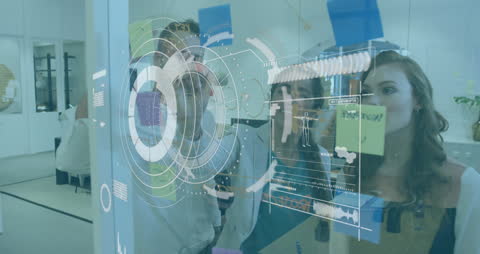 Business Team Analyzing Data with Virtual Holographic Dashboard