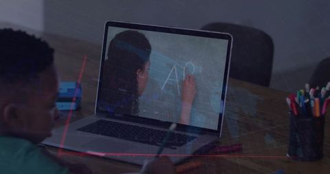 Child Learning Online with Educational Video on Laptop