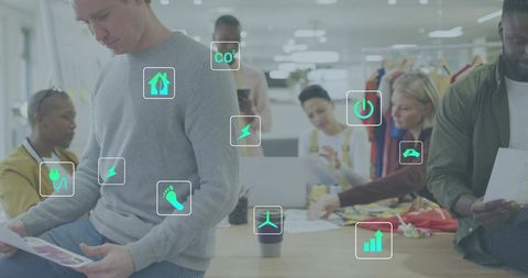 Creative design team collaborating on sustainable apparel with analytics and eco icons