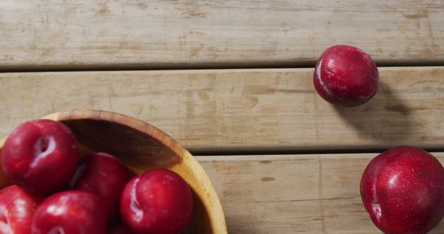 Fresh Red Plums in Bowl on Wooden Tabletop - Download Free Stock Images Pikwizard.com