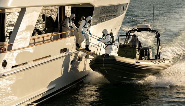 Hazmat boarding operation: rib team transferring on luxury yacht via narrow gangplank