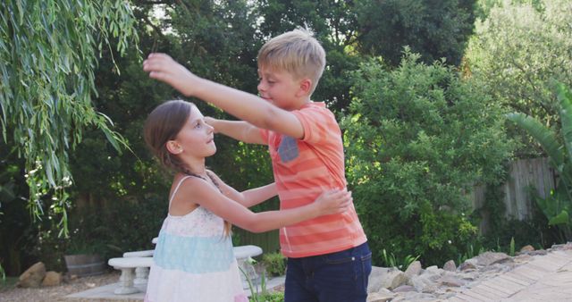 Happy Siblings Hugging in Lush Backyard Garden - Download Free Stock Images Pikwizard.com