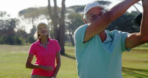 Senior Couple Enjoying a Day of Golf on Sunny Course - Download Free Stock Images Pikwizard.com