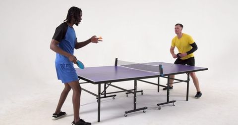 Energetic Table Tennis Match Between Two Diverse Athletes