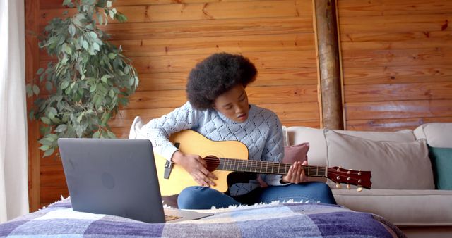 Young Woman Learning Guitar at Home with Laptop - Download Free Stock Images Pikwizard.com