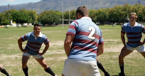 Rugby Team Engaging in Intense Training Session Under Clear Skies - Download Free Stock Images Pikwizard.com