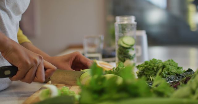 Person Preparing Fresh Vegetables for Healthy Meal in Modern Kitchen - Download Free Stock Images Pikwizard.com