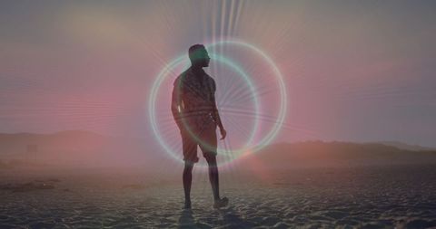 Silhouette man standing on sunset beach with neon halo glow and pastel twilight vibes