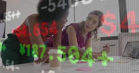 Team Analyzing Financial Data System in Modern Office Setting