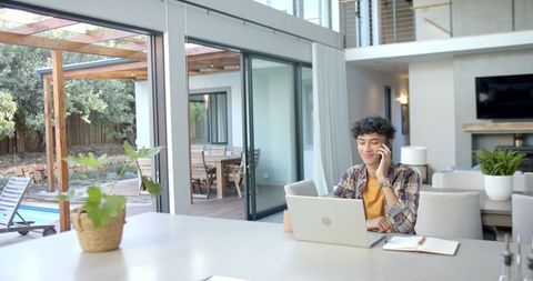 Remote Work in Modern Home with Garden and Pool View