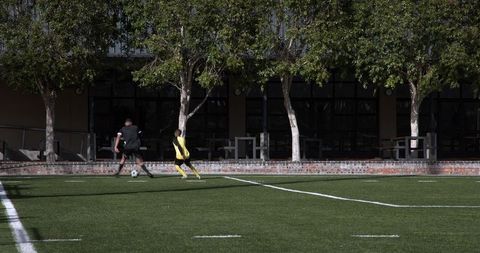 Kids Engaging in Competitive Soccer Match at School - Download Free Stock Images Pikwizard.com