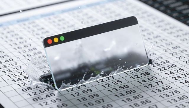 Transparent browser window sliding over financial spreadsheet, water splashing droplets
