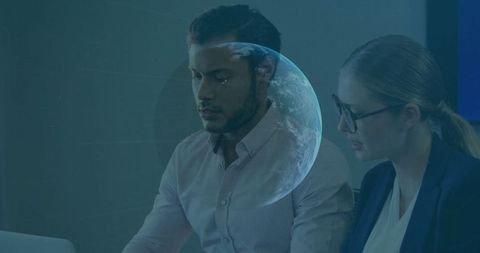 Business Colleagues Analyzing with Futuristic Planet Overlay