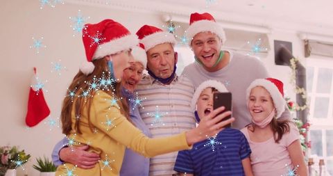 Family Celebrating Christmas with Selfie in Santa Hats