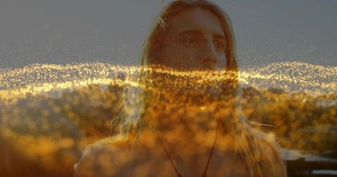 Man Contemplating Cityscape at Sunrise