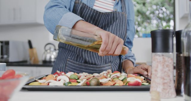 Close-Up of Home Chef Drizzling Olive Oil on Fresh Vegetables - Download Free Stock Images Pikwizard.com