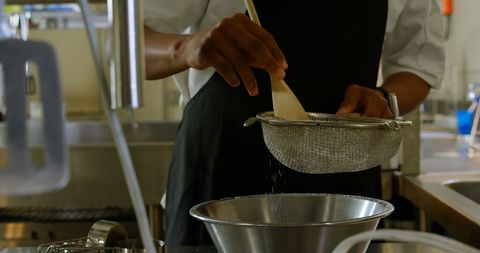 Chef Sifting Flour in Modern Kitchen for Baking Preparation - Download Free Stock Images Pikwizard.com